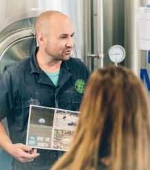 Imagine Nation Brewing's Head Brewer explaining the brewing process to visitors.