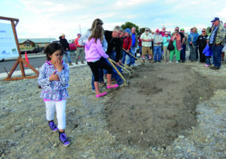 Jack Lawson and community members of the Stevensville community members at a ground breaking for the Twin Creeks subdivision.