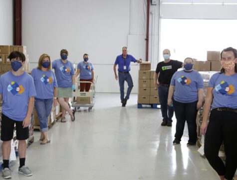 People standing in a food bank - Clearwater Donates $25,000 to Montana Food Bank Network.