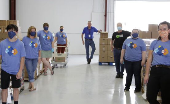 People standing in a food bank - Clearwater Donates $25,000 to Montana Food Bank Network.