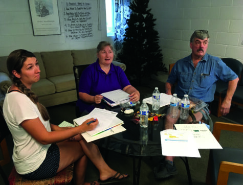 Two women and one man meet to discuss forming a Resident Owned Community (ROC).