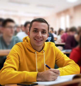 student taking notes while studying in school.