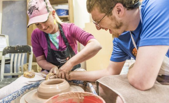 Opportunity Resources Client participating in the assisted pottery program.