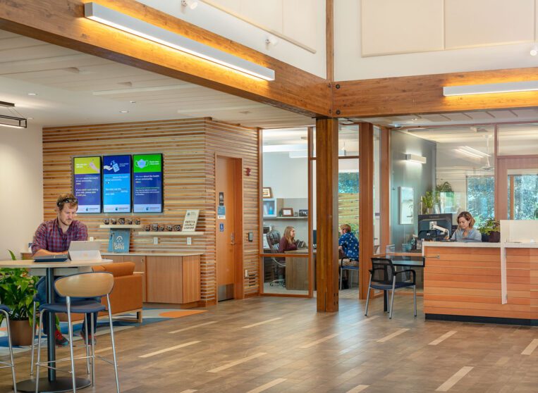 Man sitting a table in the lobby of the Clearwater Credit Union Brooks St Branch.