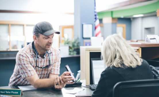 Clearwater staff person helping a member at the Downtown Missoula branch.