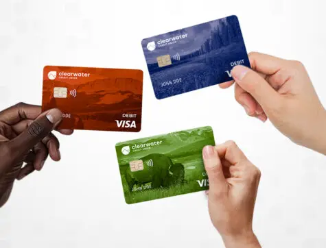 hands holding new Clearwater Credit Union Debit Card designs