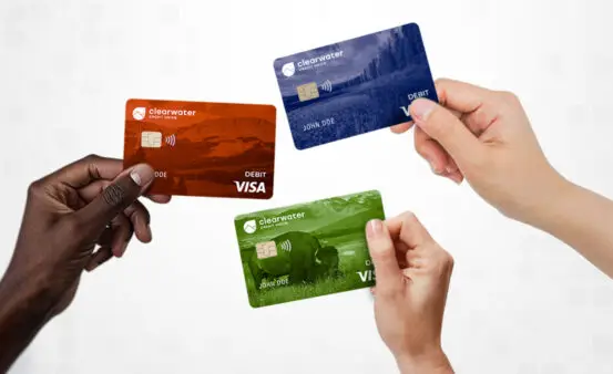 hands holding new Clearwater Credit Union Debit Card designs